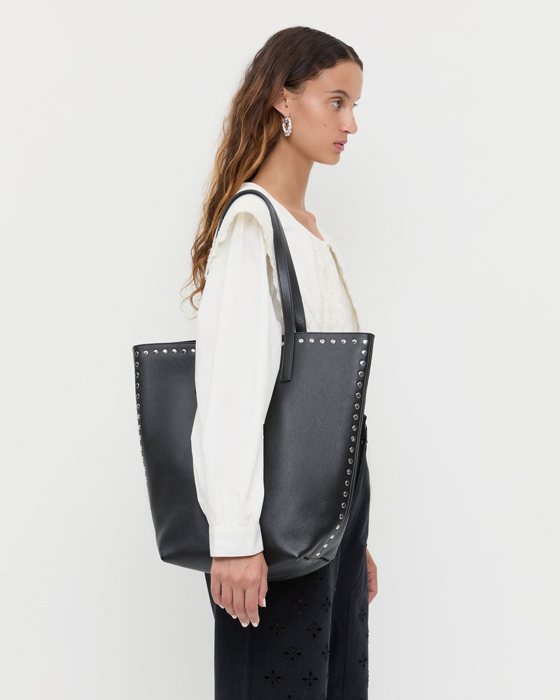Walker Black/Silver Leather Tote in black pebbled leather and silver studs, Ken Shirt in White, and Demi Embroidered Pant in black.