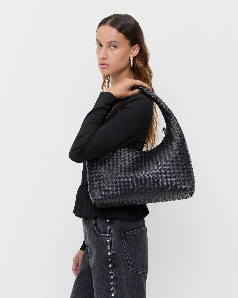 Willow Black Woven Hobo Bag in black woven leather and Winona Denim Barrel Pant in washed black and silver studs.
