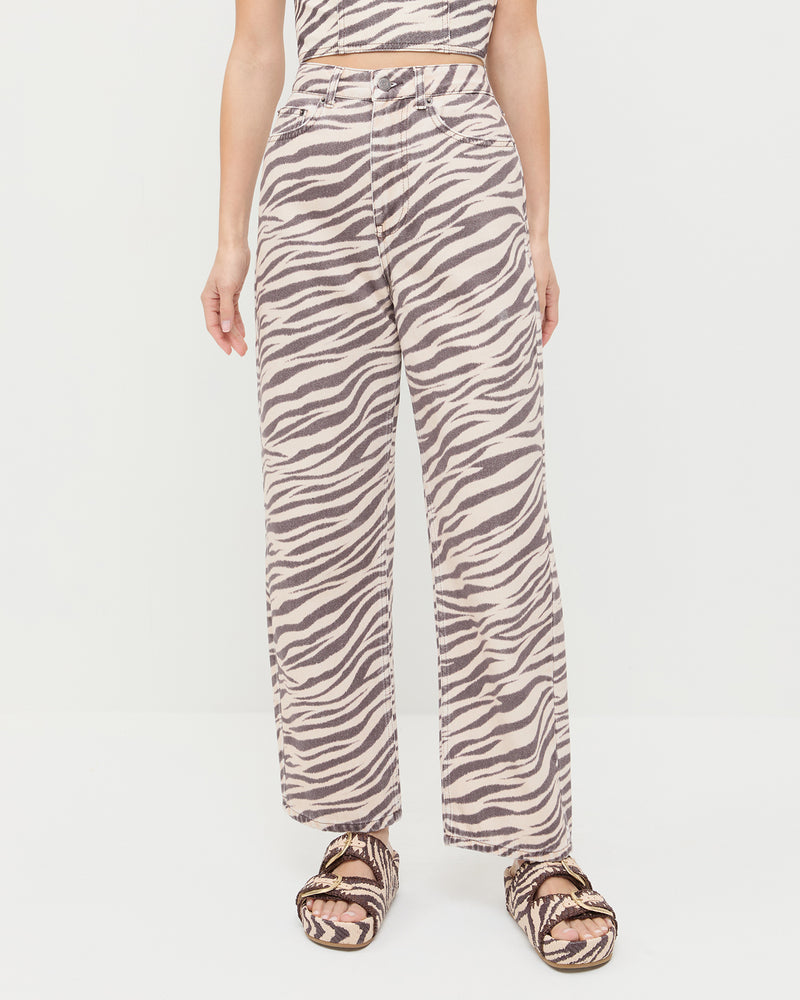 Winona Denim Pant in straight leg zebra print and Nico Zebra Two-Band Sandal.