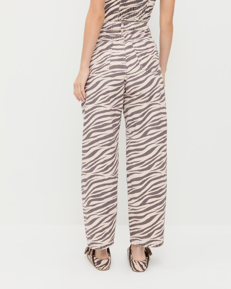 Winona Denim Pant in straight leg zebra print and Nico Zebra Two-Band Sandal.