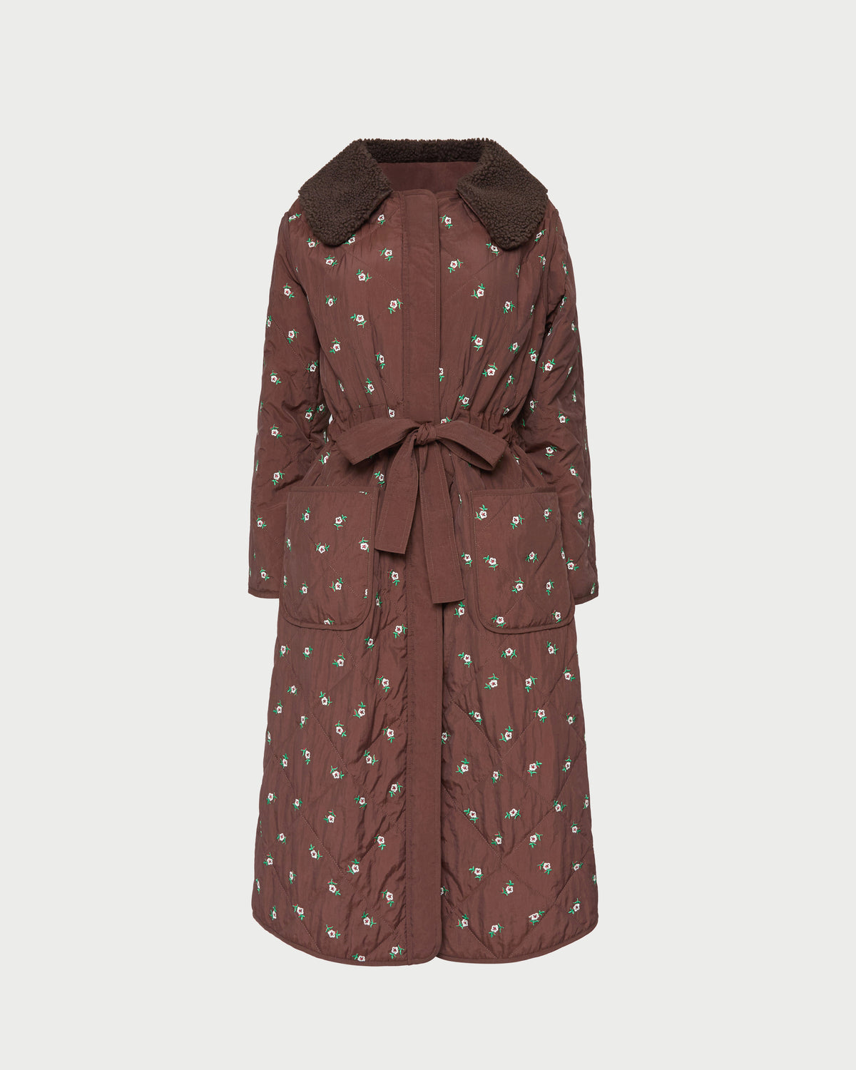 Wyatt Quilted Coat in brown nylon with flower embroidery.