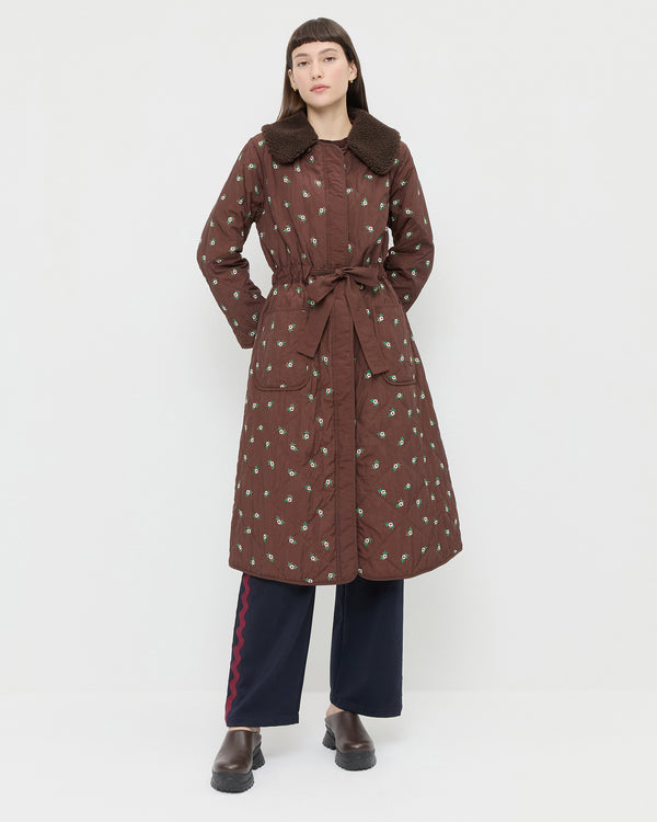 Wyatt Quilted Coat in brown nylon with flower embroidery, Venus Track Pant in navy nylon, and Gemma Brown Leather Lug Mule.