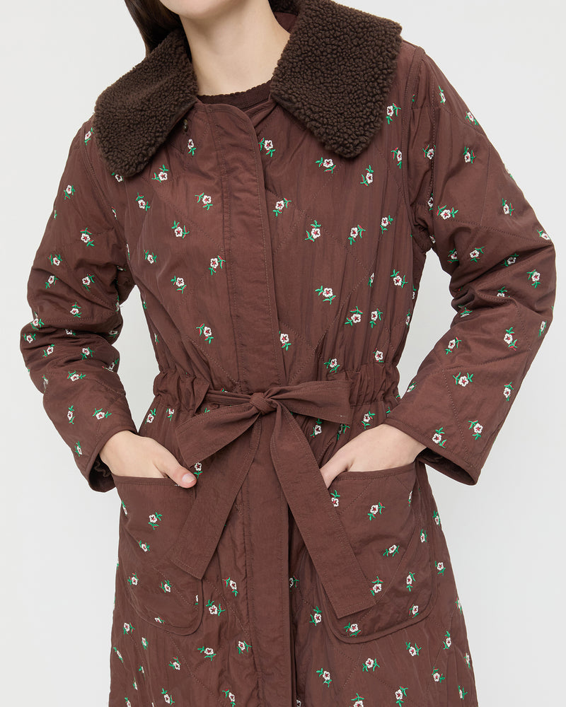 Wyatt Quilted Coat in brown nylon with flower embroidery.