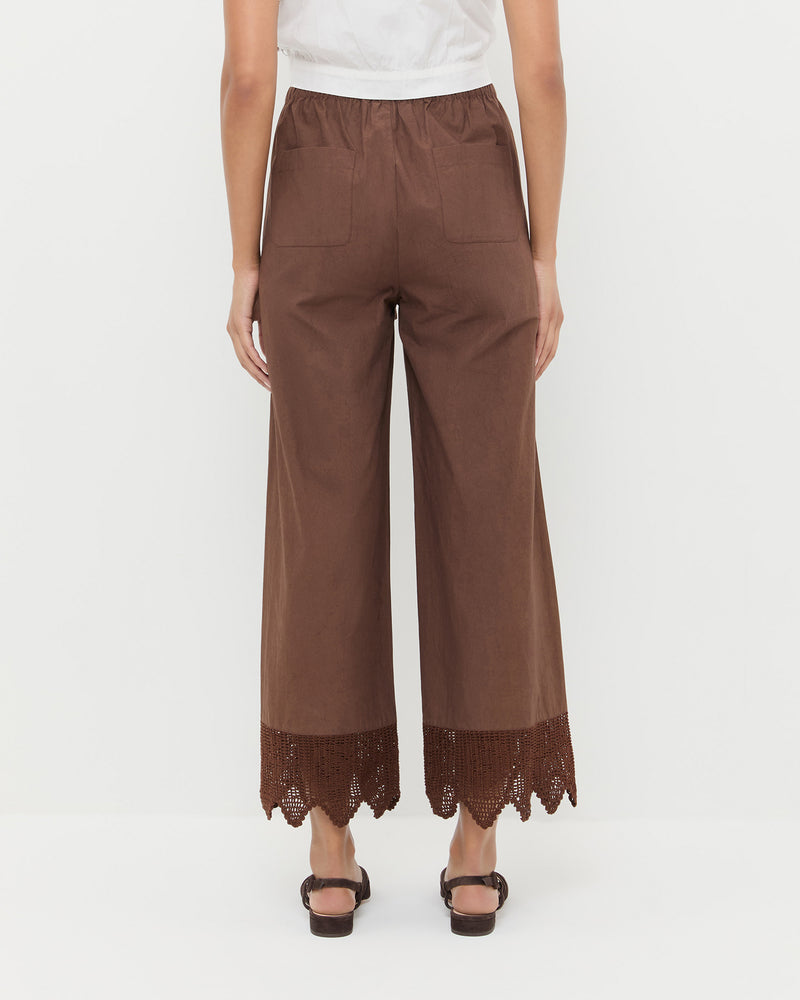 Amani Pant in dark brown cotton, Runa Top in white cotton, and Shelly Brown Suede Flat Sandal.