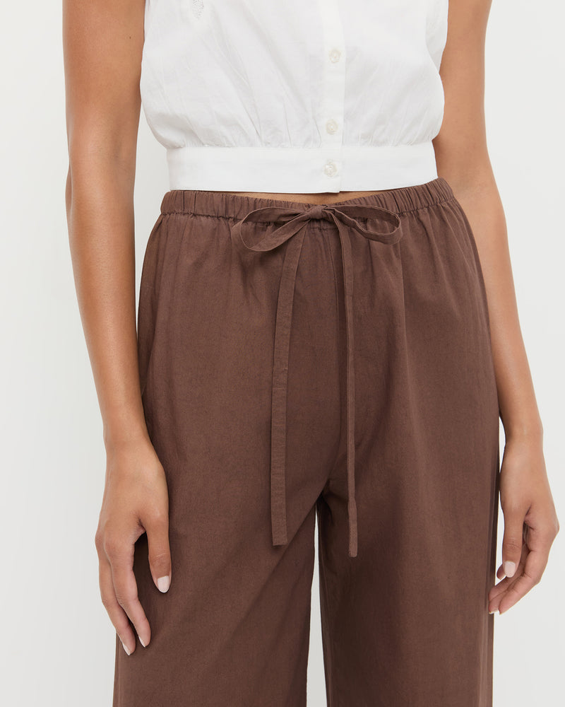 Amani Pant in dark brown cotton and Runa Top in white cotton.