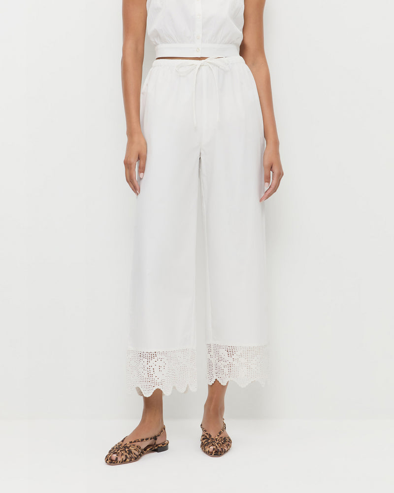 Amani Pant in white cotton and Devon Leopard Slingback Sandal.