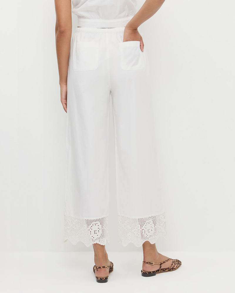 Amani Pant in white cotton and Devon Leopard Slingback Sandal.