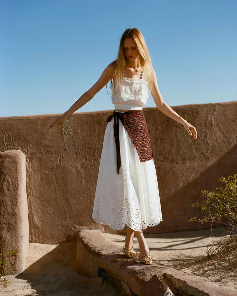 Betty Brown Crochet Apron, Tinsley Skirt in white cotton, and Runa Top in white cotton.