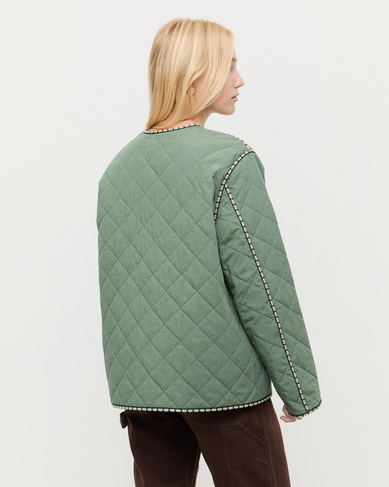 Carolina Quilted Coat in sage green quilted nylon and Molly Workwear Jean in dark brown denim.