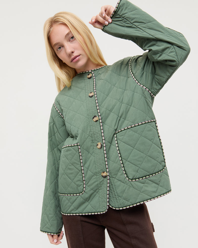 Carolina Quilted Coat in sage green quilted nylon and Molly Workwear Jean in dark brown denim.