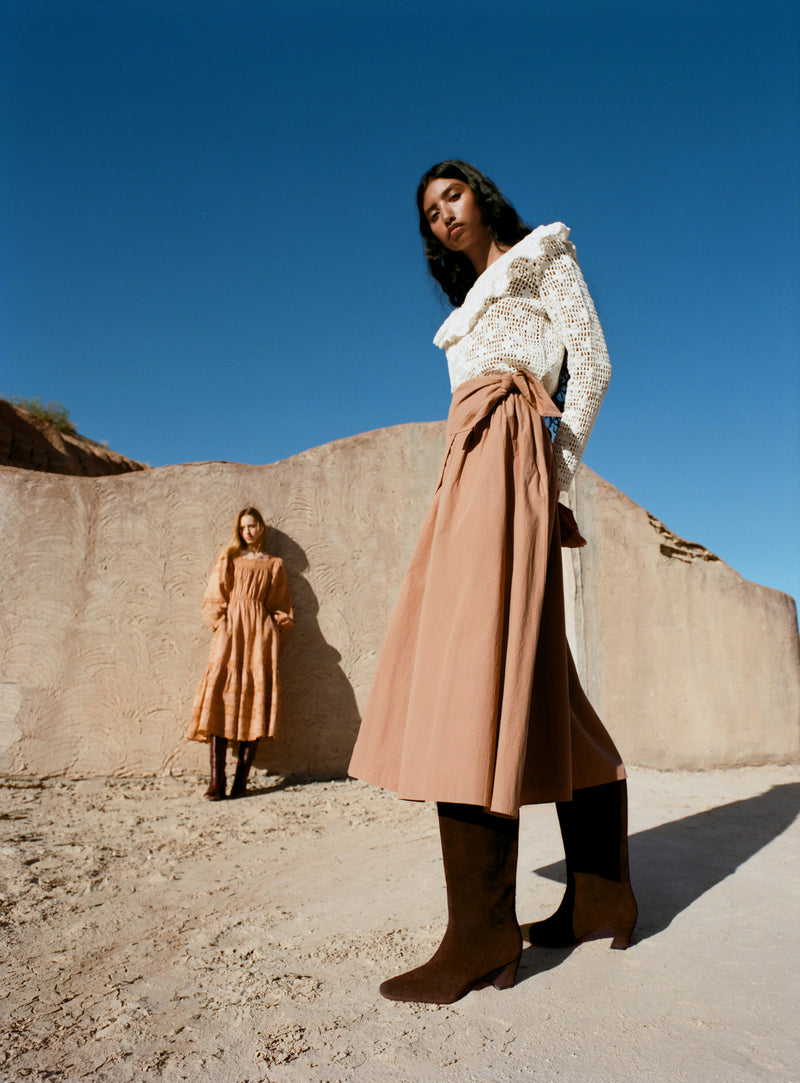 Cleo Brown Suede Mid-Calf Boot in brown suede, Abigail Top in cream crocheted cotton, and Peyton Skirt.