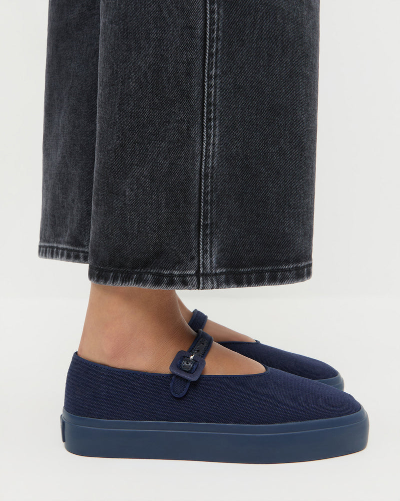 Cooper Navy Mary Jane Sneaker and Molly Workwear Jean in washed black denim.