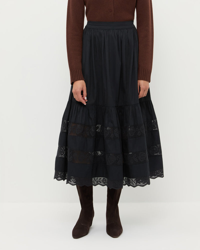 Delaney Skirt in black cotton, Tucker Cashmere Cardigan in brown, and Cleo Brown Suede Mid-Calf Boot.
