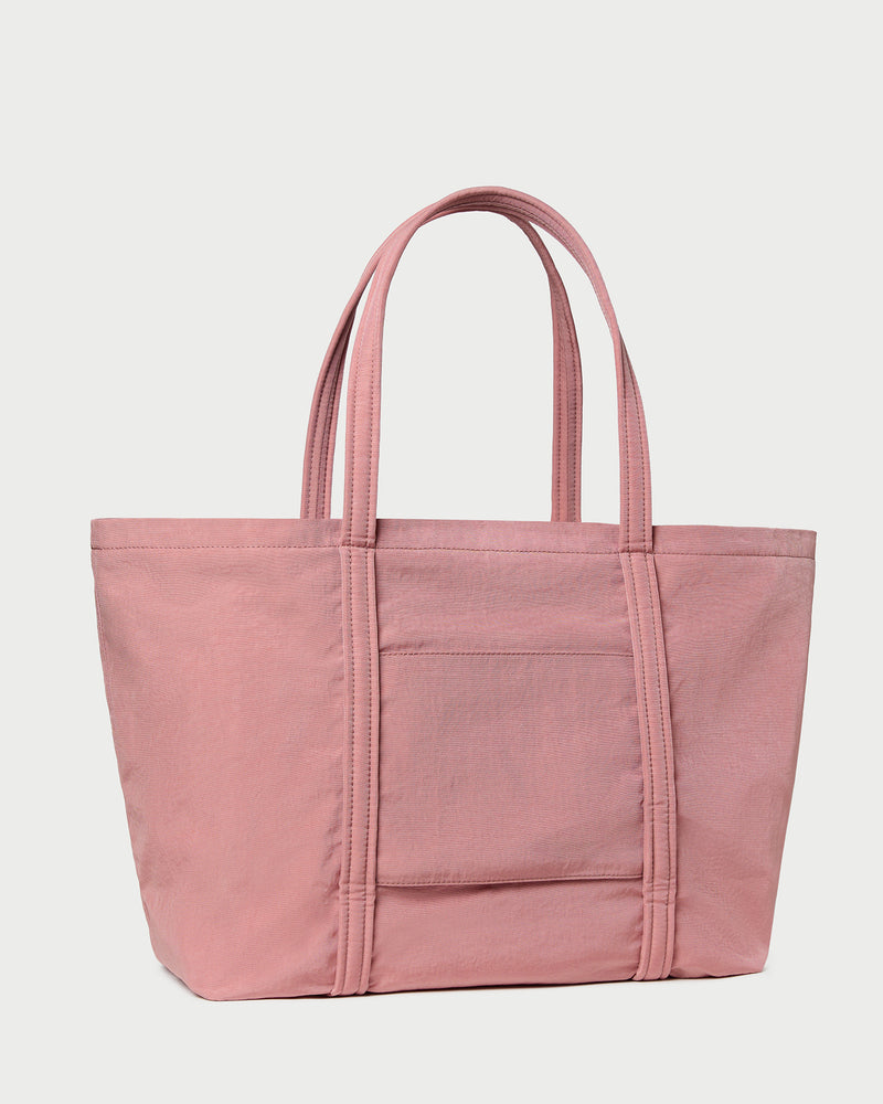 Dina Pink Travel Tote in pink water-resistant nylon.
