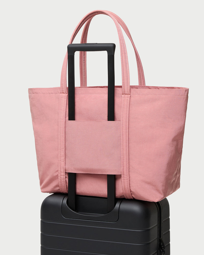 Dina Pink Travel Tote in pink water-resistant nylon.
