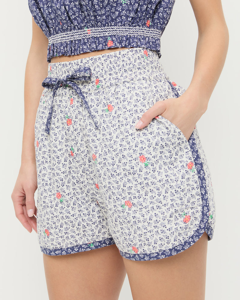 Flynn Quilted Short in white floral cotton and Maggie Camisole in navy floral cotton.