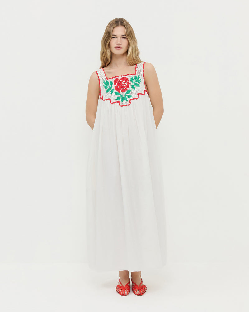Hetty Dress in white cotton with hand embroidered crochet flower and Devon Red Moiré Slingback Sandal.