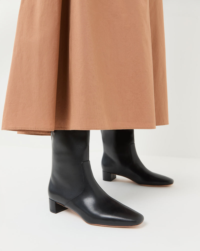 Indy Black Leather Tall Boot in black leather and Peyton Skirt.