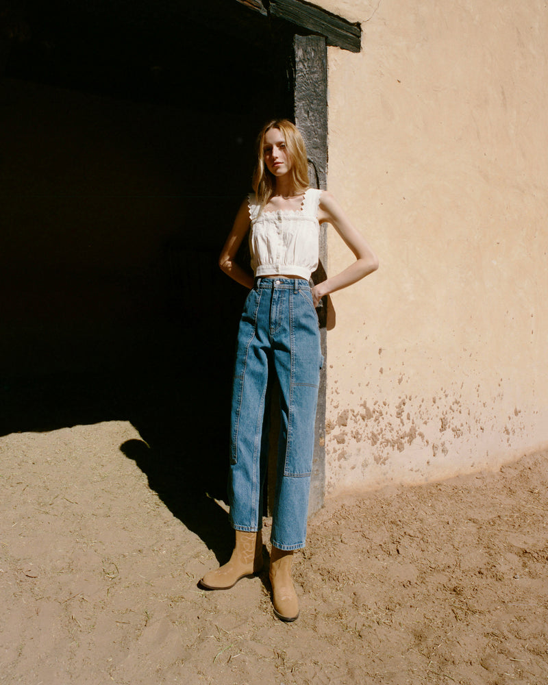 Jett Sand Suede Calf Boot in sand tan suede and western inspired, Runa Top in white cotton, and Molly Workwear Jean in medium washed denim.