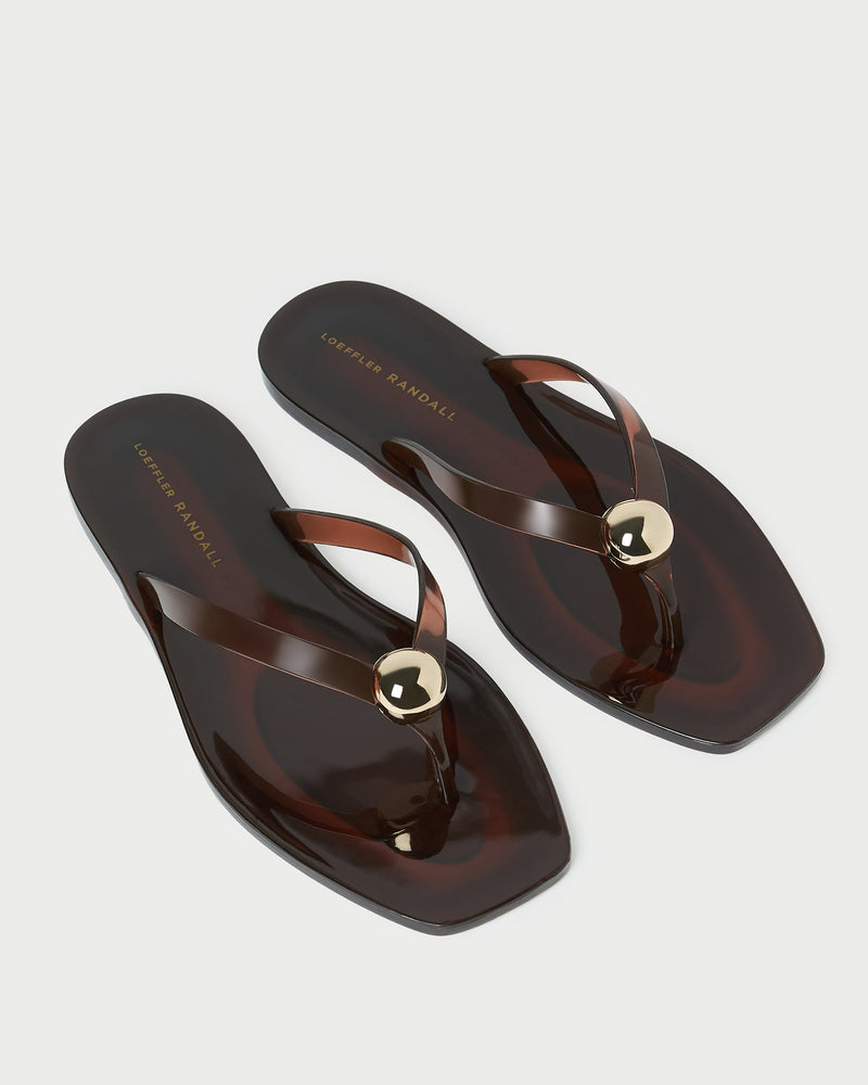 Jovie Brown Jelly Flip Flop in brown jelly with gold accent.
