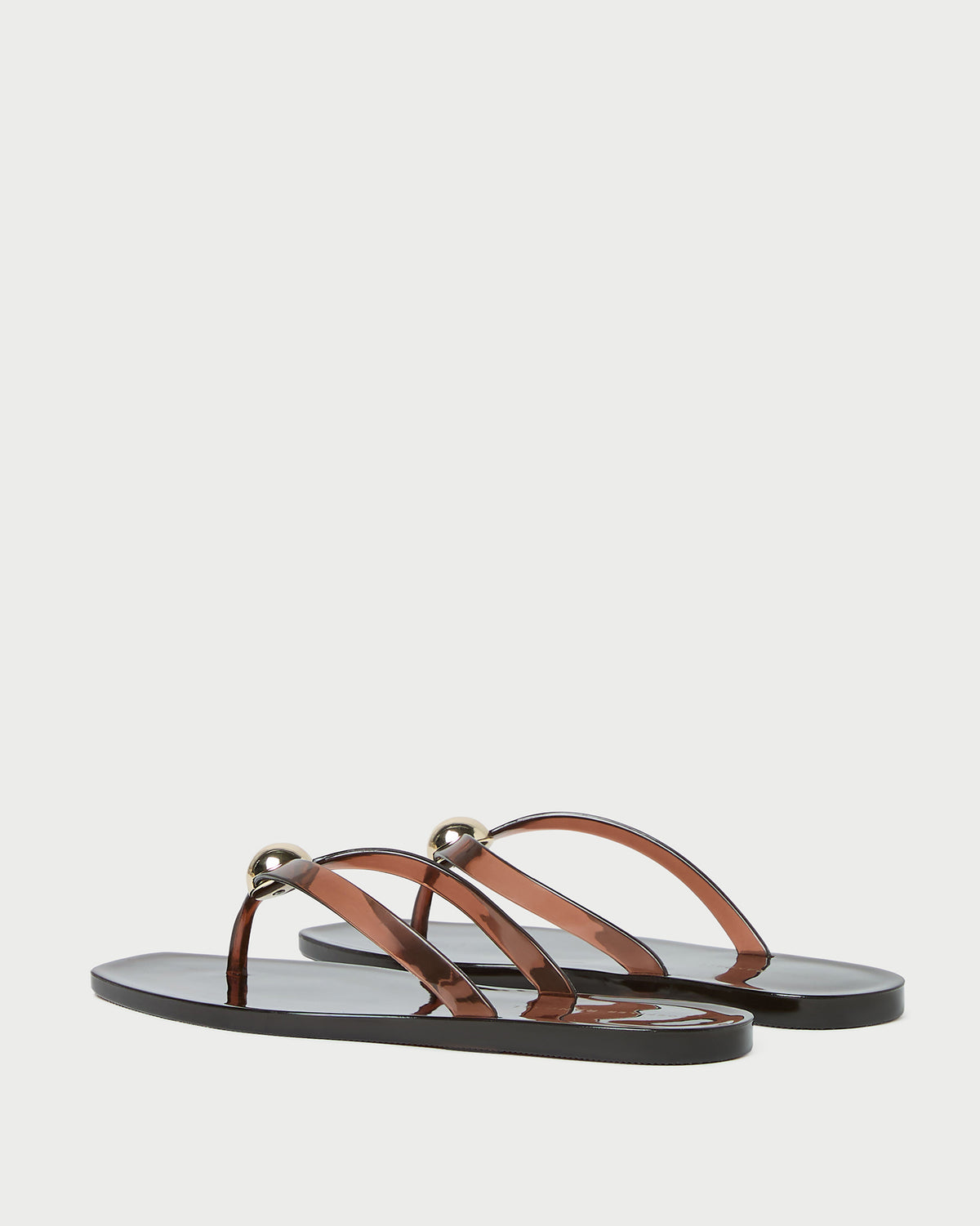 Jovie Brown Jelly Flip Flop in brown jelly with gold accent.