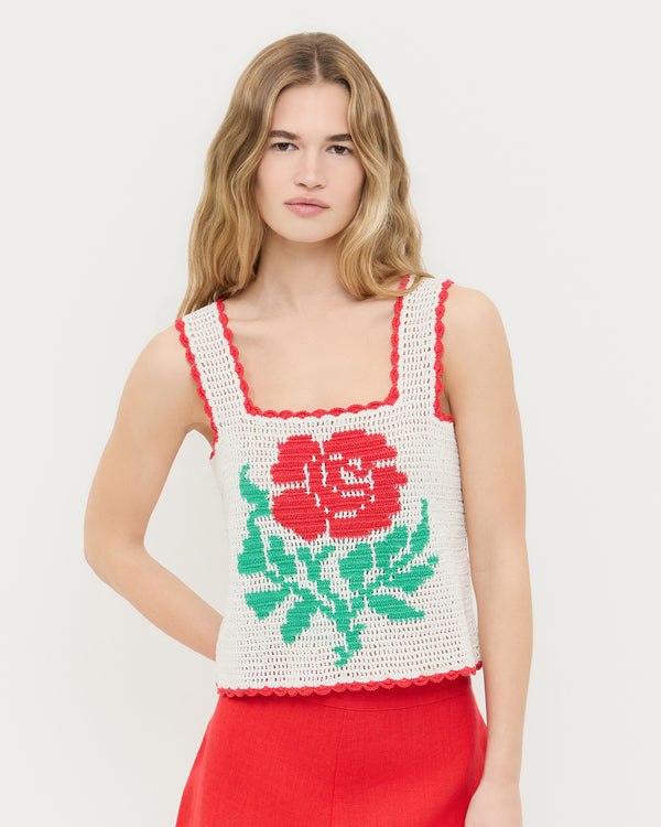 Juliette Top in white hand crocheted cotton with a flower accent and Carissa Short in red linen. 