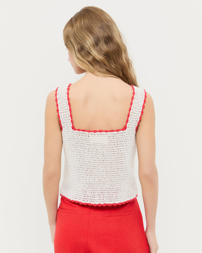 Juliette Top in white hand crocheted cotton with a flower accent and Carissa Short in red linen. 