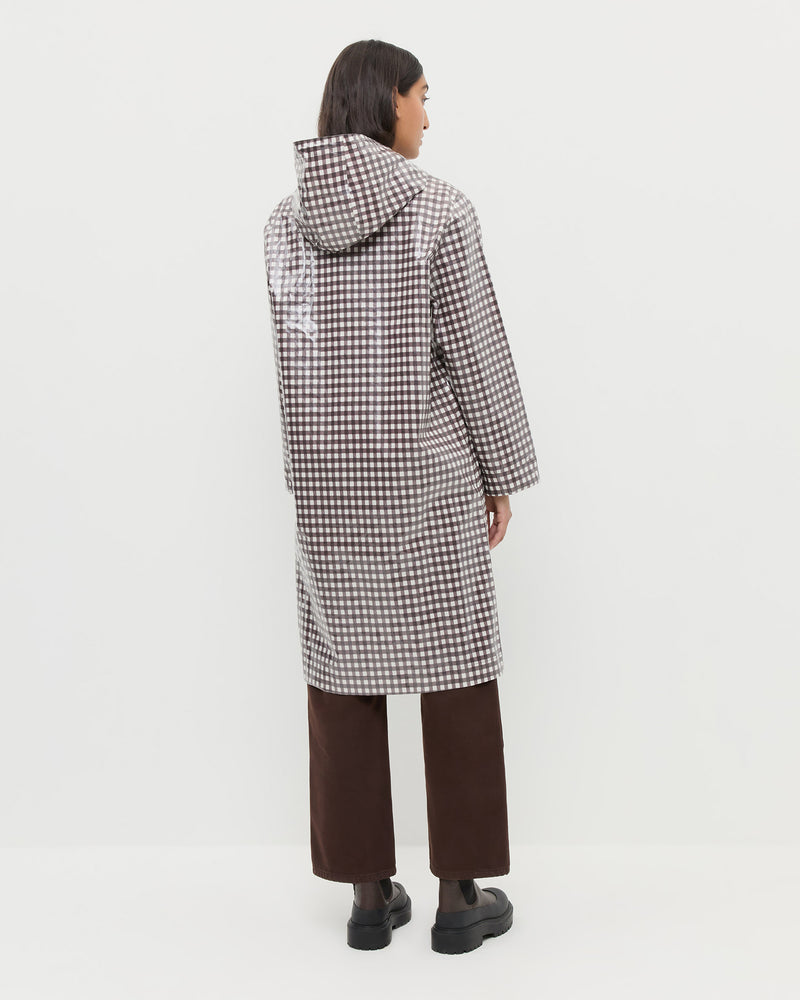 Kat Rain Coat in brown gingham cotton, Molly Workwear Jean in dark brown denim, and Suri Brown Leather Lug Boot.