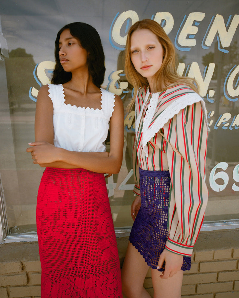 Ken Shirt in tan, red, and green striped cotton and Elowen Skirt in purple crocheted cotton.