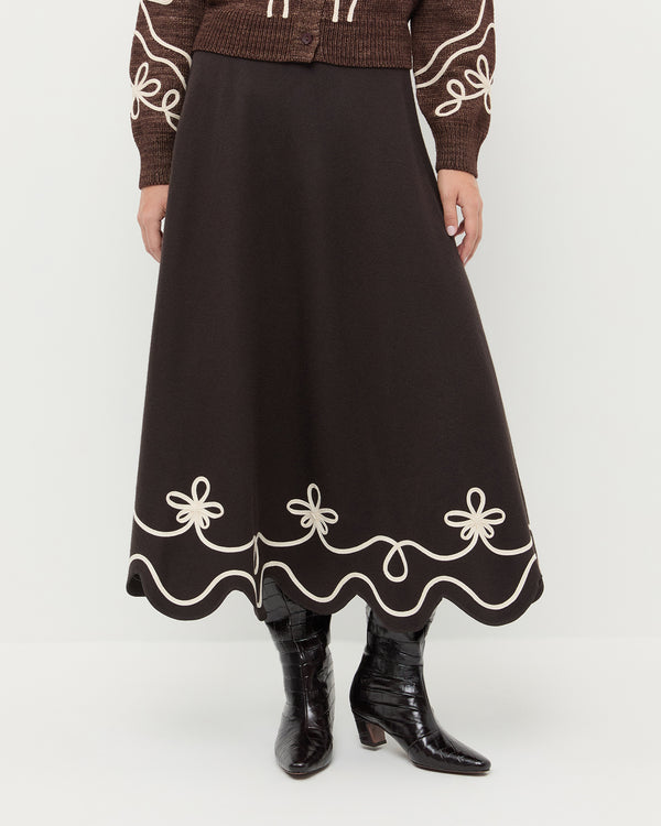 Linnea Skirt in brown wool with cream detailing, Diaz Sweater in brown wool, and Marley Crocodile Leather Tall Boot.