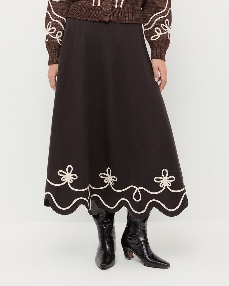 Linnea Skirt in brown wool with cream detailing, Diaz Sweater in brown wool, and Marley Crocodile Leather Tall Boot.