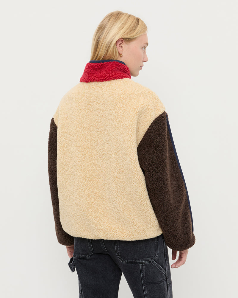 Liz Fleece in cream fleece with multi colored accents and Molly Workwear Jean in washed black denim.