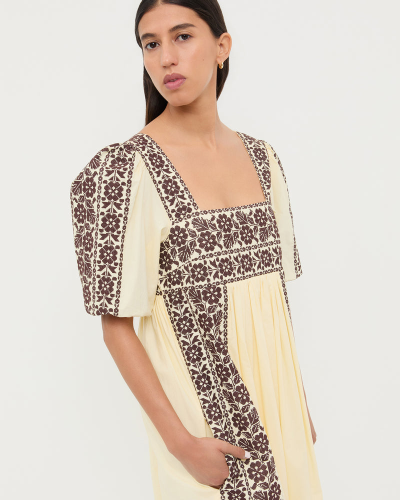 Lotus Embroidered Dress in butter yellow cotton with brown embroidery.