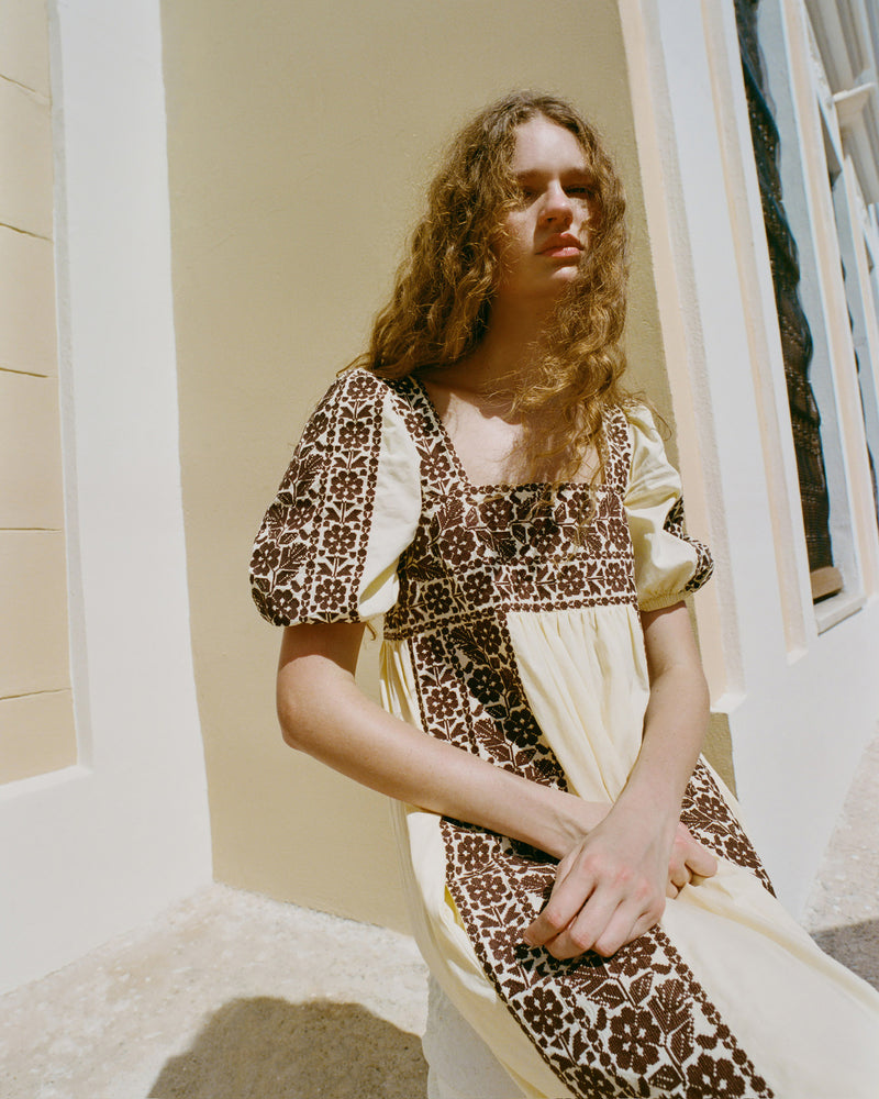 Lotus Embroidered Dress in butter yellow cotton with brown embroidery.