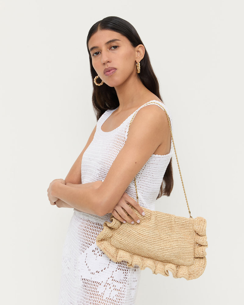 Mavis Natural Raffia Ruffle Clutch in natural raffia, Aurelie Sleeveless Top in white crochet cotton, and Sullivan Crochet Skirt white crochet cotton.