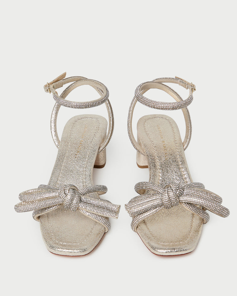 Mikel Cappuccino Bow Mid-Heel Sandal in light champagne sparkle suede