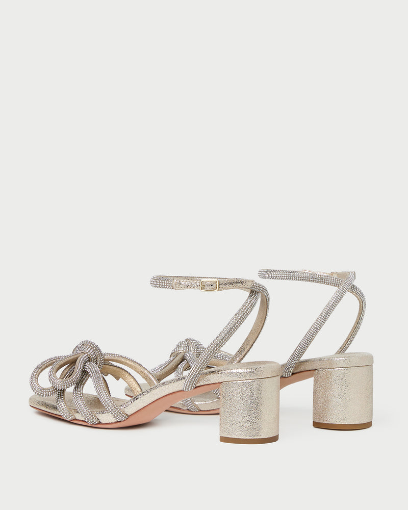Mikel Cappuccino Bow Mid-Heel Sandal in light champagne sparkle suede