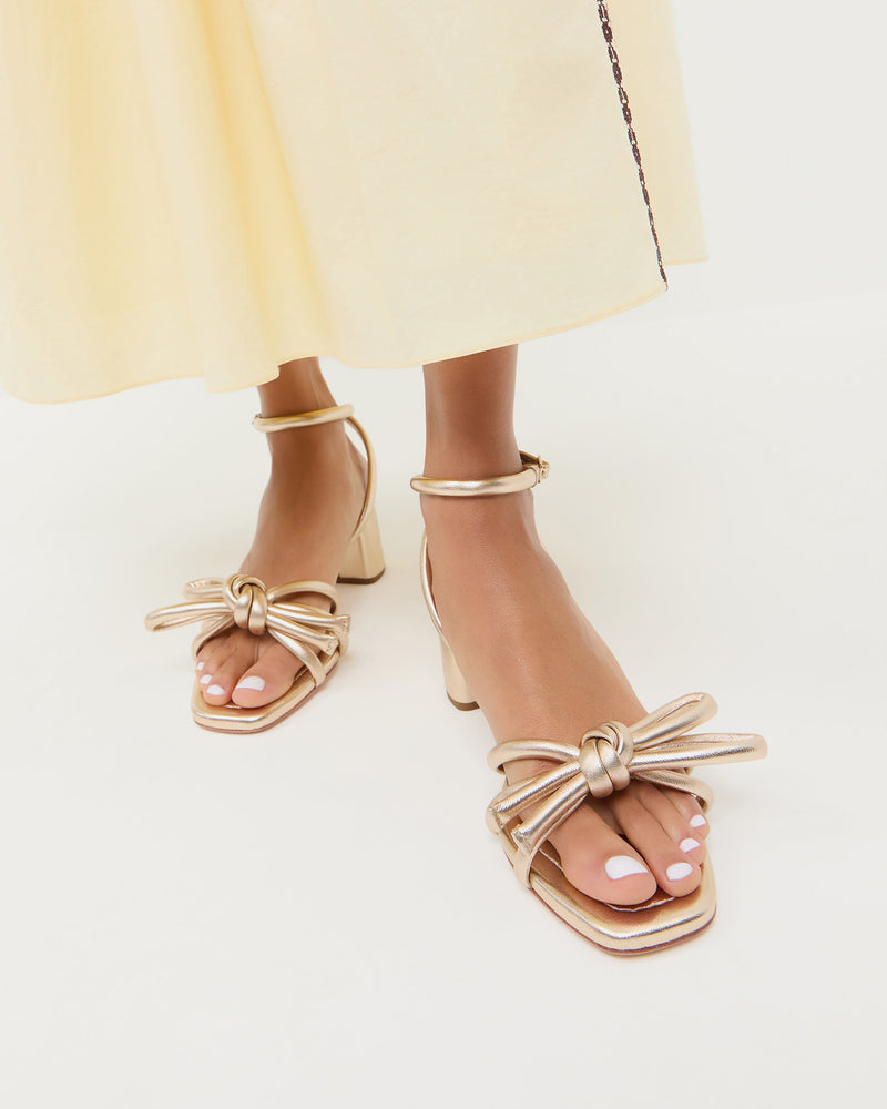 Mikel Champagne Bow Mid-Heel Sandal in metallic champagne nappa leather