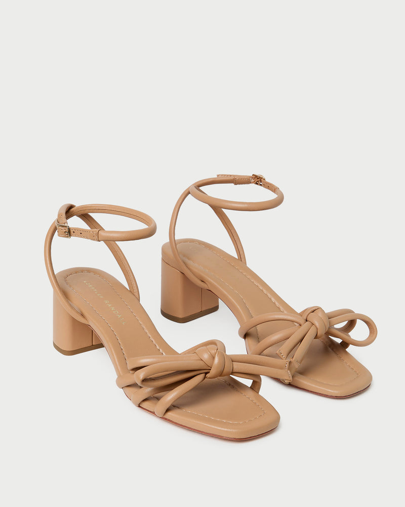 Mikel Dune Bow Mid-Heel Sandal in beige tan leather.