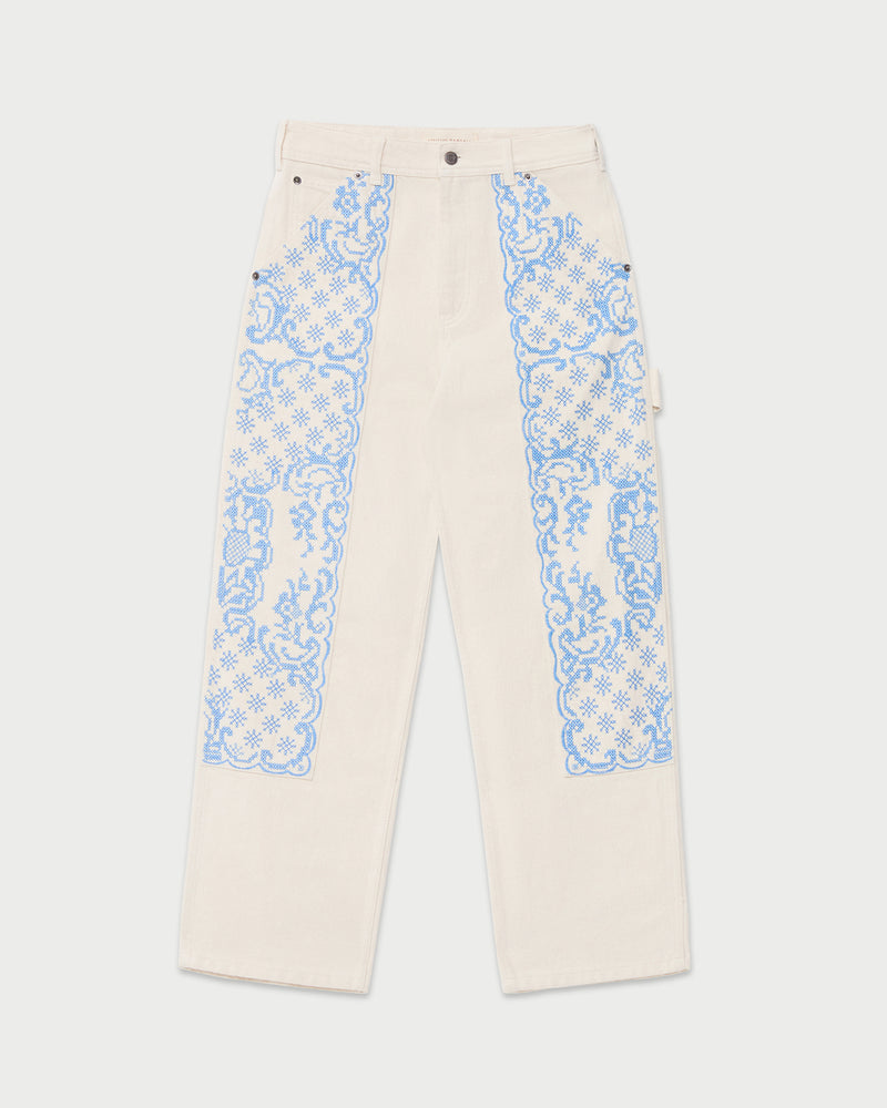 Molly Workwear Jean in natural denim with blue embroidery.