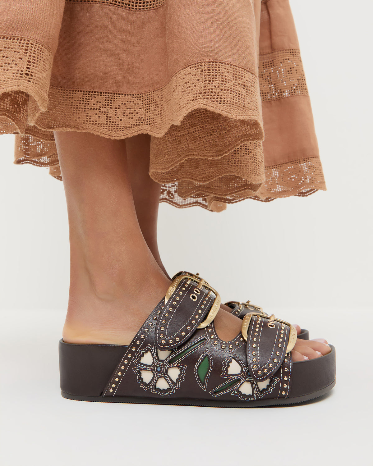 Nell Brown/Butter Two-Band Sandal with butter yellow tulip details and studded accents.