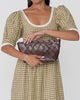 Melina Chocolate Woven Leather Clutch and Gillian Puff Sleeve Dress in brown plaid.