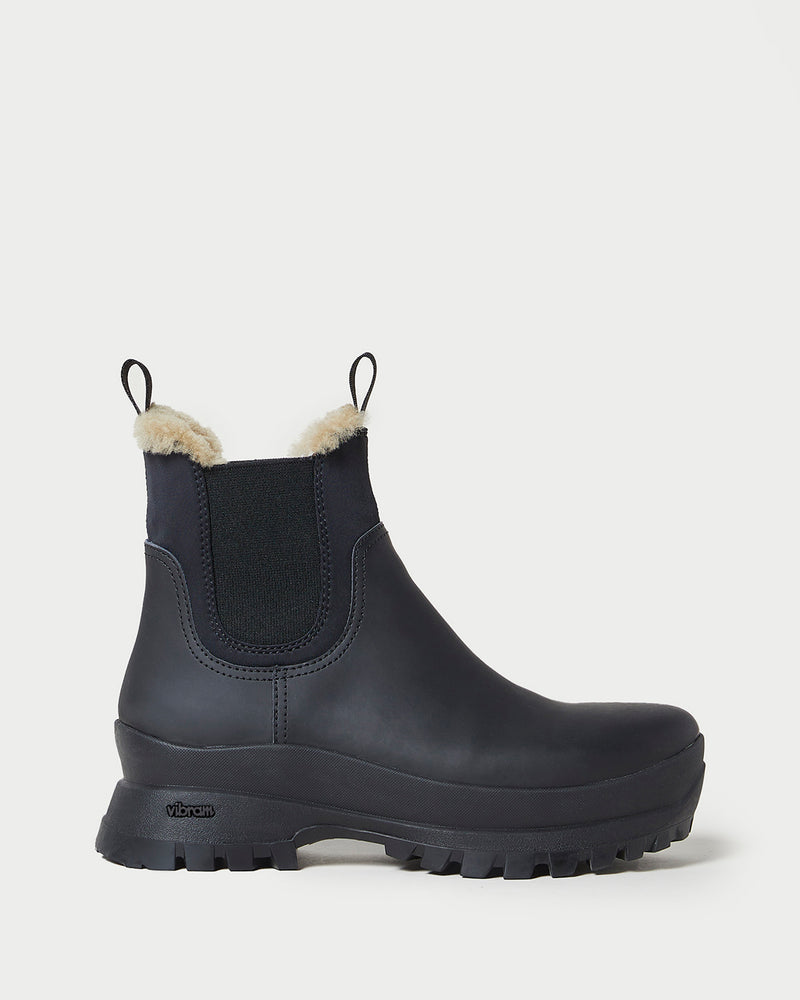 Tara Black Shearling-Lined Boot in black leather.