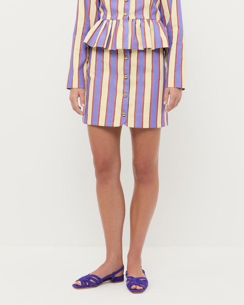 Vita Skirt in jewel and butter striped cotton-linen fabric, Sable Jacket in jewel and butter striped cotton-linen fabric, and Shelly Jewel Suede Flat Sandal.