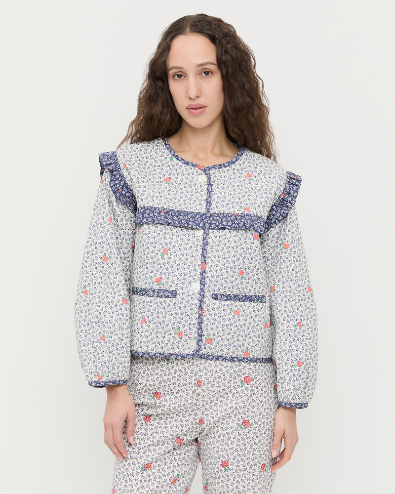 Winslet Jacket in blue floral cotton and Pasha Trouser in white floral cotton-linen.