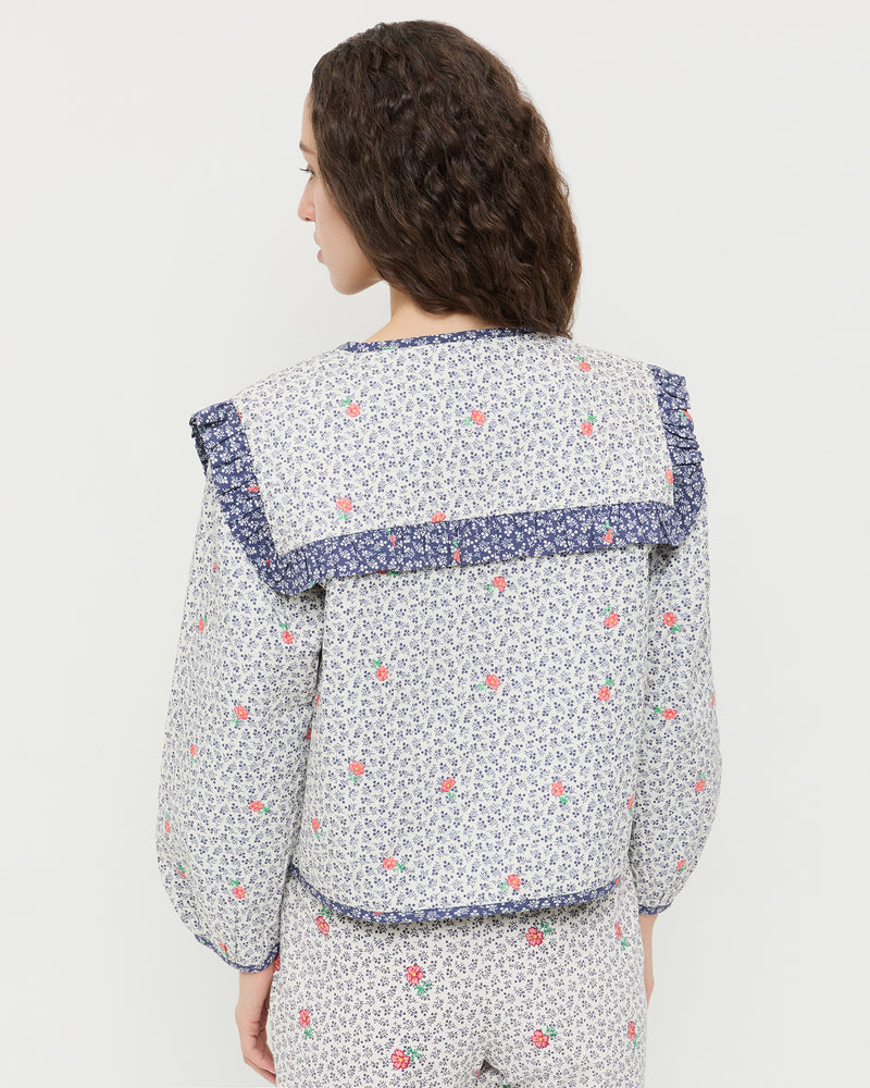 Winslet Jacket in blue floral cotton and Pasha Trouser in white floral cotton-linen.