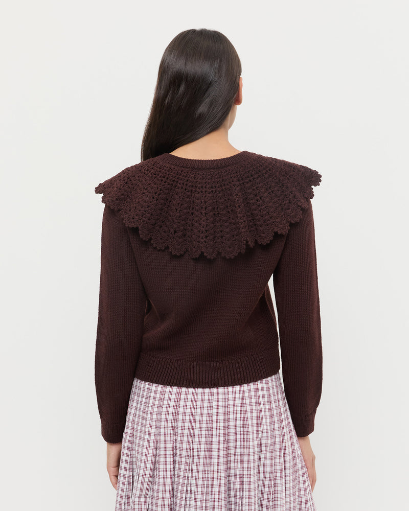 Wynn Cardigan in dark brown wool, Emlyn Midi Skirt in cream, maroon, and lilac plaid cotton.