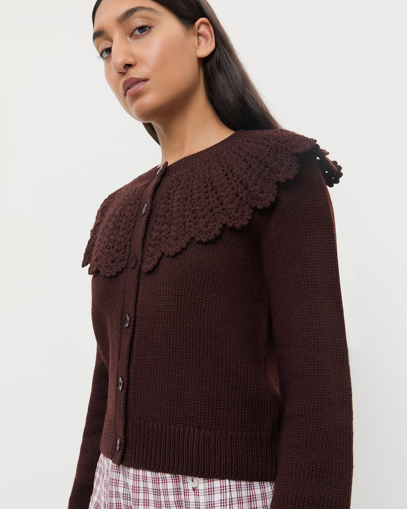 Wynn Cardigan in dark brown wool, Emlyn Midi Skirt in cream, maroon, and lilac plaid cotton.